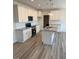 Modern kitchen with white cabinetry, granite countertops and a center island at 161 Jones Creek Ln, Lillington, NC 27546