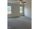 Spacious main bedroom with neutral walls, carpet and two windows at 161 Jones Creek Ln, Lillington, NC 27546