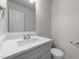 Bright bathroom featuring a white vanity with a solid surface countertop and modern fixtures at 202 Wimbledon Ct, Clayton, NC 27520