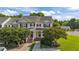 Charming two-story townhouse with a well-maintained front yard and inviting entrance with brick steps at 202 Wimbledon Ct, Clayton, NC 27520