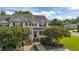Charming two-story townhouse with a well-maintained front yard and inviting entrance with brick steps at 202 Wimbledon Ct, Clayton, NC 27520