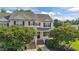 Inviting two-story townhome with a well-manicured lawn and brick-lined entryway, creating great curb appeal at 202 Wimbledon Ct, Clayton, NC 27520