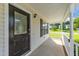 Inviting front porch with classic trim, offers a welcoming entrance and covered outdoor space at 202 Wimbledon Ct, Clayton, NC 27520