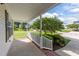 Charming front porch featuring white railings, brick steps and a pleasant view of the neighborhood at 202 Wimbledon Ct, Clayton, NC 27520