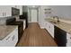 An open kitchen with stainless steel appliances, granite countertops and plenty of natural light at 2053 Alderman Way, Creedmoor, NC 27522