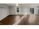 Bright living room with wood floors and sliding glass doors to the backyard at 2053 Alderman Way, Creedmoor, NC 27522