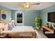 Bedroom with modern furnishings, neutral paint, and bright window at 2053 Alderman Way, Creedmoor, NC 27522