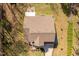 Aerial view of a well-maintained home with a manicured lawn and an expansive roofline at 2053 Stillwood Dr, Youngsville, NC 27596