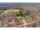 Scenic aerial of homes surrounded by trees, including long driveways and partial lawns at 2053 Stillwood Dr, Youngsville, NC 27596