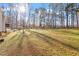 Expansive backyard featuring a large lawn, mature trees, and plenty of open space at 2053 Stillwood Dr, Youngsville, NC 27596