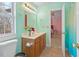 Bright bathroom with wood vanity and a natural light at 2053 Stillwood Dr, Youngsville, NC 27596