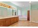 Bright bathroom featuring a double vanity, soaking tub, and separate shower at 2053 Stillwood Dr, Youngsville, NC 27596