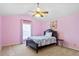 Cozy bedroom featuring pink walls, a twin bed, and a vaulted ceiling with ceiling fan at 2053 Stillwood Dr, Youngsville, NC 27596