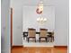 Elegant dining room with hardwood floors, decorative chandelier, and ample space for entertaining at 2053 Stillwood Dr, Youngsville, NC 27596