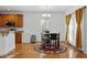 Bright dining area with a round table and views to the backyard at 2053 Stillwood Dr, Youngsville, NC 27596