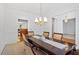 Beautiful dining room with hardwood floors, elegant chandelier, and neutral tones at 2053 Stillwood Dr, Youngsville, NC 27596