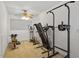 Well-lit exercise room with multiple workout machines at 2053 Stillwood Dr, Youngsville, NC 27596