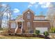 Charming brick two-story home with manicured lawn and attached two-car garage at 2053 Stillwood Dr, Youngsville, NC 27596