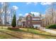 Charming brick two-story home with manicured lawn and attached two-car garage at 2053 Stillwood Dr, Youngsville, NC 27596