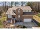Beautiful brick home featuring a two-car garage, manicured landscaping, and a welcoming front porch at 2053 Stillwood Dr, Youngsville, NC 27596