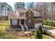 Stately brick home with a two-car garage, white trimmed windows, and a well-maintained front yard at 2053 Stillwood Dr, Youngsville, NC 27596