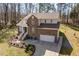 Attractive brick home featuring a two-car garage, large driveway, and beautifully landscaped front yard at 2053 Stillwood Dr, Youngsville, NC 27596