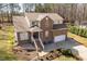 Charming brick home with a well-manicured lawn, mature trees, and a two-car garage at 2053 Stillwood Dr, Youngsville, NC 27596