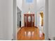 Grand foyer with soaring ceilings, hardwood floors, and elegant front door with leaded glass at 2053 Stillwood Dr, Youngsville, NC 27596