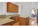 Kitchen area features granite countertops and custom wood cabinetry at 2053 Stillwood Dr, Youngsville, NC 27596