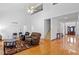Spacious living room with lots of light, hardwood floors, and a high ceiling at 2053 Stillwood Dr, Youngsville, NC 27596