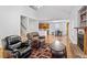 Bright open living room area with fireplace and dining area at 2053 Stillwood Dr, Youngsville, NC 27596