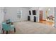 Spacious living room with neutral carpet, a large window, and access to other rooms at 2053 Stillwood Dr, Youngsville, NC 27596