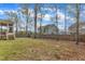 Fenced backyard with lawn and patio at 215 Mystic Pine Pl, Apex, NC 27539