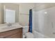 Cozy bathroom featuring a vanity, toilet, and a bathtub with shower, perfect for relaxation at 215 Mystic Pine Pl, Apex, NC 27539
