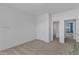 Bright bedroom with doorways, neutral paint, and soft carpeting at 215 Mystic Pine Pl, Apex, NC 27539