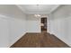 Spacious dining room with wood floors, paneled walls, and elegant lighting at 215 Mystic Pine Pl, Apex, NC 27539
