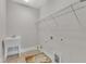 Utility room with basin sink, tiled floor, and open wiring shelf for storage at 215 Mystic Pine Pl, Apex, NC 27539