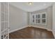 Bright office space featuring a window with shutters and hardwood floors at 215 Mystic Pine Pl, Apex, NC 27539