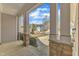 Inviting front porch with stone accents, sturdy columns, and a view of the neighborhood at 215 Mystic Pine Pl, Apex, NC 27539