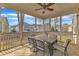 Cozy screened porch with dining area at 215 Mystic Pine Pl, Apex, NC 27539