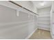 Spacious walk-in closet with shelving and hanging rods at 215 Mystic Pine Pl, Apex, NC 27539