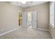 Bedroom with access to an ensuite bathroom; ceiling fan included at 2308 Carriage Oaks Dr, Raleigh, NC 27614