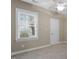 Neutral bedroom features a ceiling fan and window with blinds at 2308 Carriage Oaks Dr, Raleigh, NC 27614