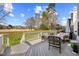 Expansive deck with seating area, offering views of the backyard and the surrounding landscape at 2308 Carriage Oaks Dr, Raleigh, NC 27614
