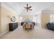 Serene main bedroom with neutral tones, tray ceiling, carpet floors, and an inviting ambiance at 2308 Carriage Oaks Dr, Raleigh, NC 27614