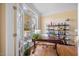 Bright office space with a large window, hardwood floors, and built in shelves, perfect for working from home at 2308 Carriage Oaks Dr, Raleigh, NC 27614