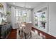 Bright breakfast nook features large window, French doors, and tasteful decor, perfect for a cozy dining experience at 2554 Club Level Dr, Apex, NC 27523