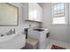 Laundry room with a washer, dryer, utility sink and cabinets at 2554 Club Level Dr, Apex, NC 27523