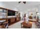 Open-concept living room with hardwood floors, and a view of the foyer and dining area at 2554 Club Level Dr, Apex, NC 27523