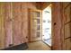 New construction entryway featuring an exterior door with glass panels, complemented by insulation and exposed framing at 2603 Vineyard St, Durham, NC 27707
